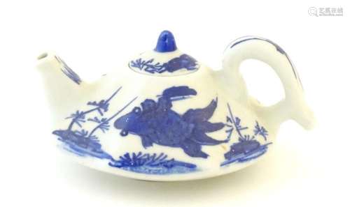 A small Chinese blue and white teapot of octagonal form deco...