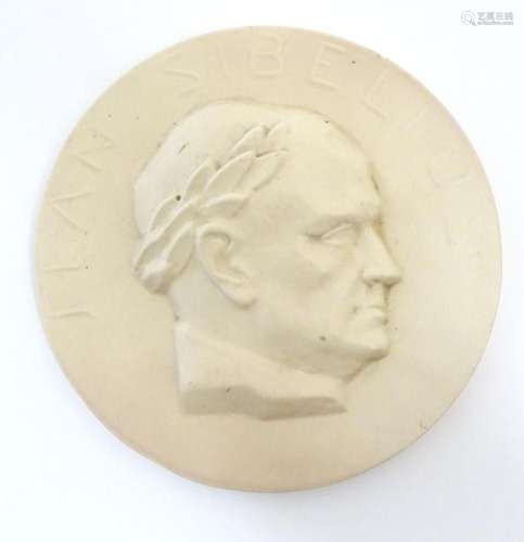 A 20thC Arabia ceramic roundel / plaque depicting a portrait...