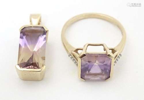 A 9ct gold ring set with central Anahi ametrine flanked by d...