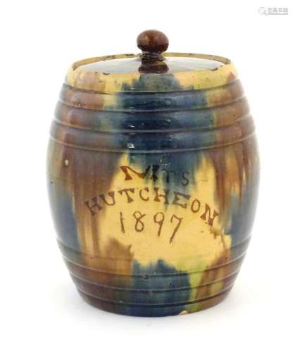 A Scottish biscuit jar and cover of barrel form marked Mrs H...