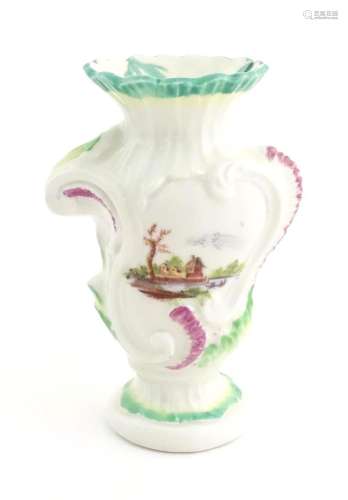 A Rococo style vase of asymmetric form decorated with hand p...