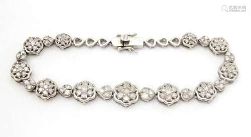 A silver bracelet set with diamonds. Approx 7 1/2" long