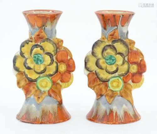 A pair of Clarice Cliff candlesticks in the My Garden patter...
