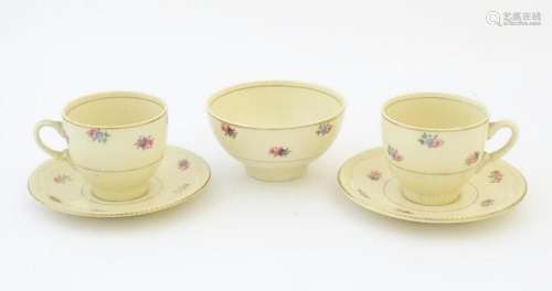 A quantity of Clarice Cliff tea wares with floral decoration...