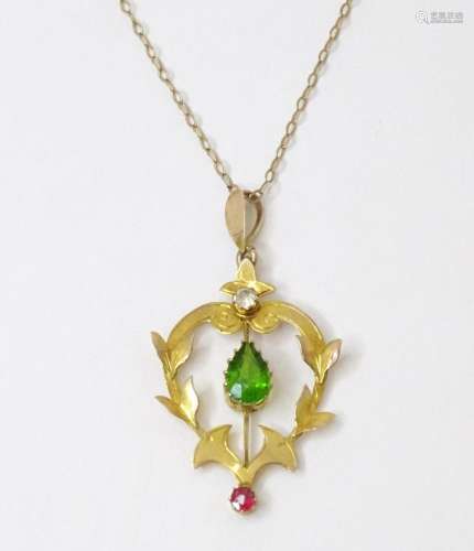 A 9ct gold Art Nouveau pendant set with red white and green ...