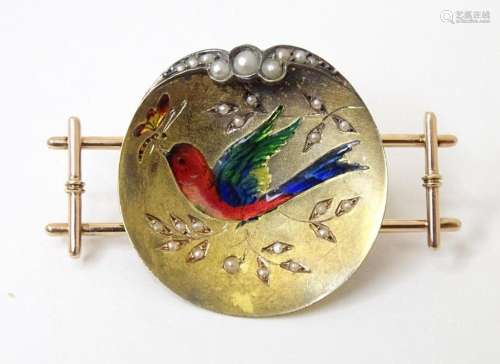 A gold and gilt metal brooch / pin with enamel bird decorati...