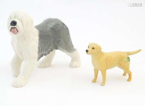 Two Beswick models of dogs comprising a Yellow Labrador, no....