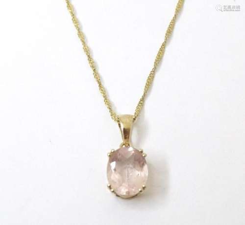 A 9ct gold pendant set with facet cut rose coloured quartz o...