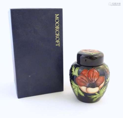 A limited edition Moorcroft ginger jar in the Anemone patter...