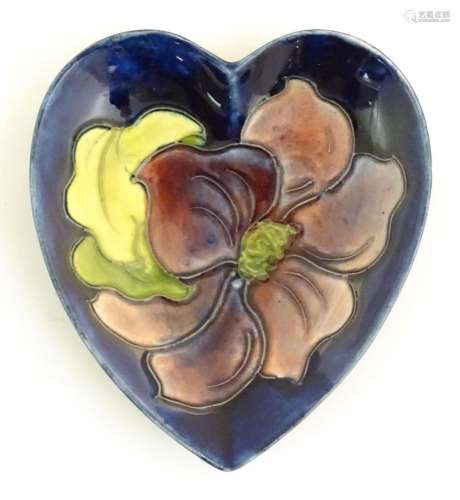 A Moorcroft dish of heart form decorated in the Clematis pat...