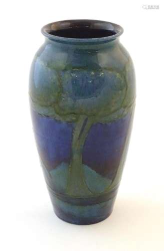 An Art Nouveau Moorcroft vase in the pattern Moonlit Blue de...