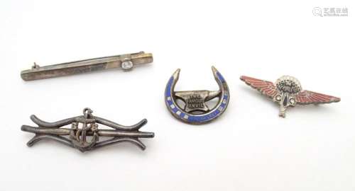 A silver bar brooch set with white stone, an enamel badge ti...