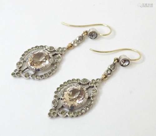 A pair of 19thC drop earrings set with paste / white stone d...