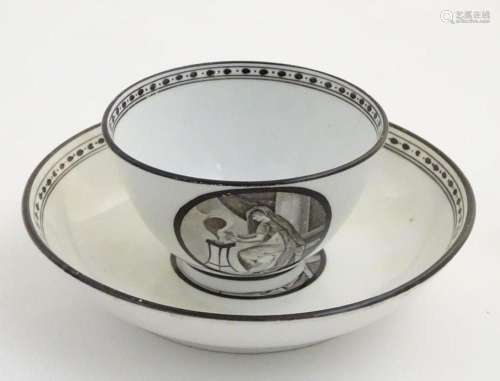 A 19thC tea bowl and saucer, decorated with monochrome round...