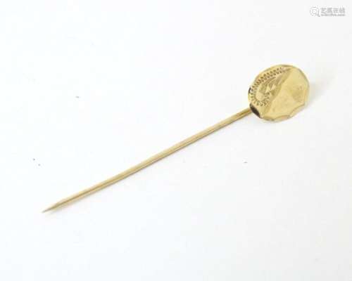 A gilt metal stick pin 1 3/4" long