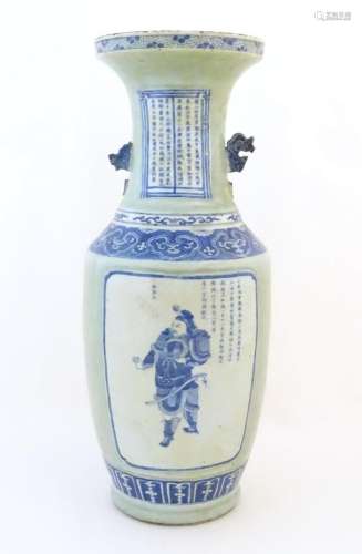 A large blue and white twin handled baluster vase with a cel...