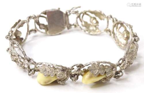 A hunting trophy bracelet set with deer teeth within a white...