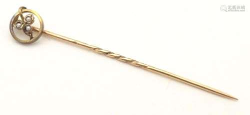 A 9ct gold stick pin with seed pearl. Approx 2 1/4" lon...