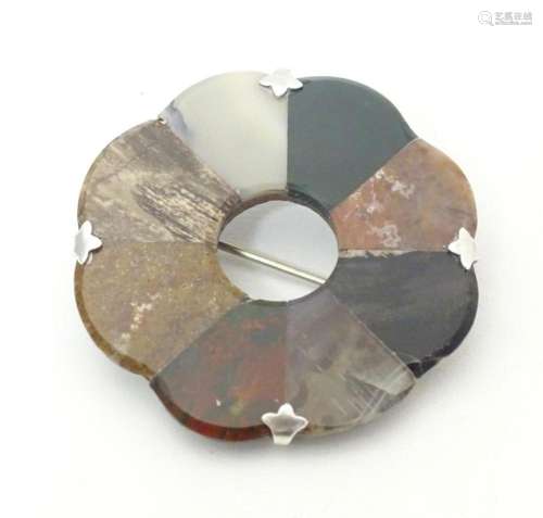 A Scottish agate hardstone brooch of roundel form with white...