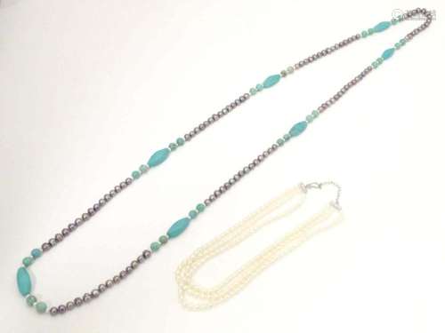 Two necklaces, one set with pearl and turquoise beads. The l...
