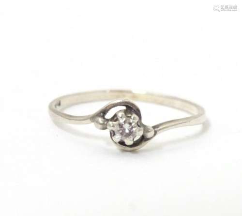 A diamond solitaire ring in a platinum setting. Ring size ap...