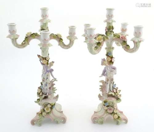 A pair of Continental porcelain candelabra / candelabrum wit...