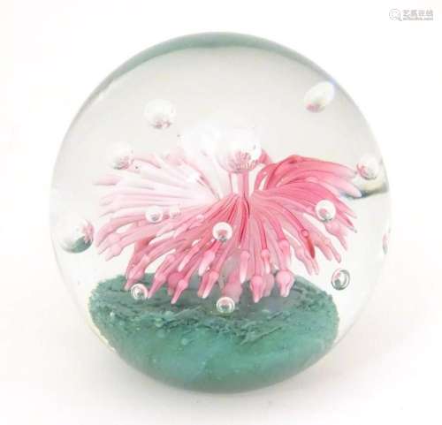 An art glass paperweight with stylised jelly fish decoration...