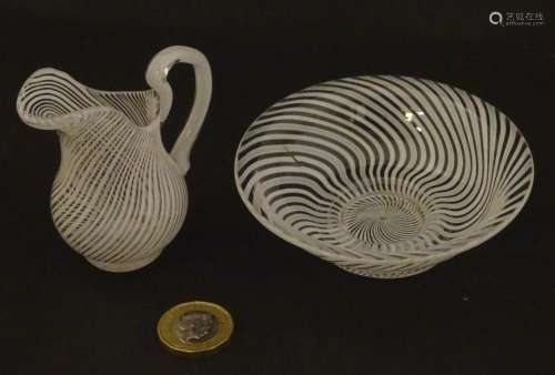 A continental glass small jug and bowl with latticinio style...