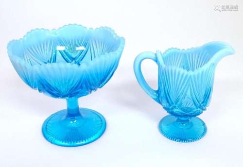 A Davidson blue glass cream jug and pedestal sugar bowl. The...