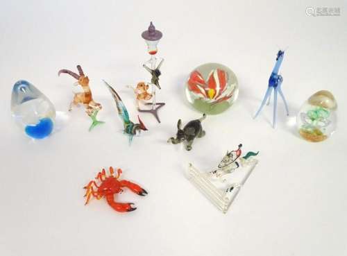 Assorted glass items to include paperweights, models of glas...