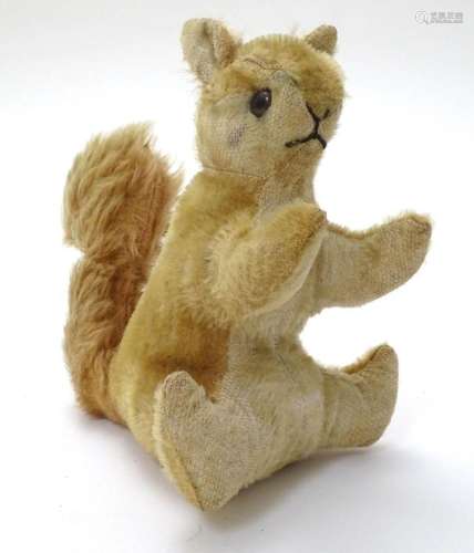 Toy: A 20thC stuffed Steiff style mohair seated squirrel toy...