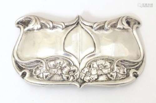 A silver 2-part belt buckle with Art Nouveau decoration. Hal...