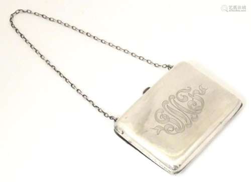 An American sterling silver purse with chain handle. Purse a...