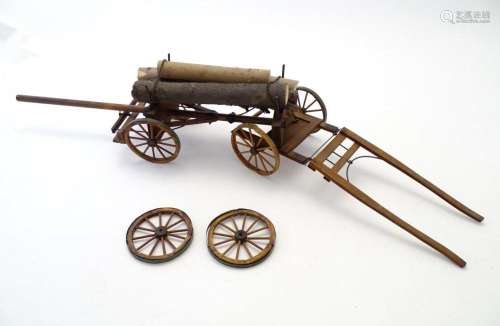Toys: A 20thC scratch built wooden model of a timber wagon w...