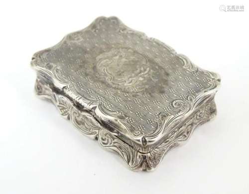 A Victorian silver vinaigrette with engraved and decoration ...