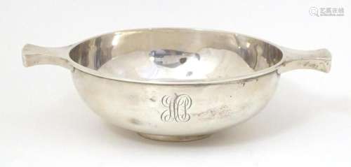 A silver twin handled bowl / porringer of oversized quaich f...