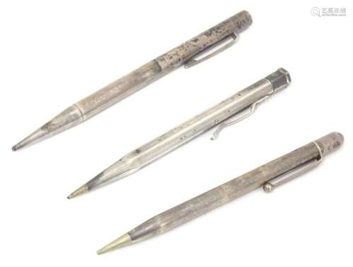 Three various silver propelling pencils, to include one hall...