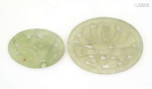 Two Oriental carved jade coloured soapstone ovals with flora...
