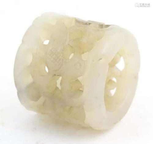 A Chinese carved hardstone archers thumb ring with pierced d...