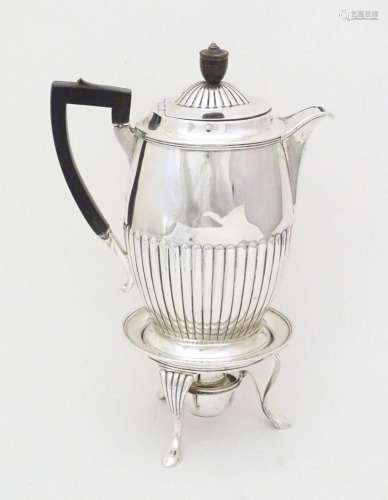 A Victorian silver hot water pot with stand and burner, the ...