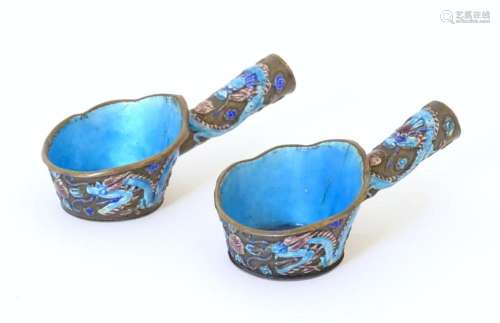 Two Chinese silk irons with enamel decoration depicting drag...