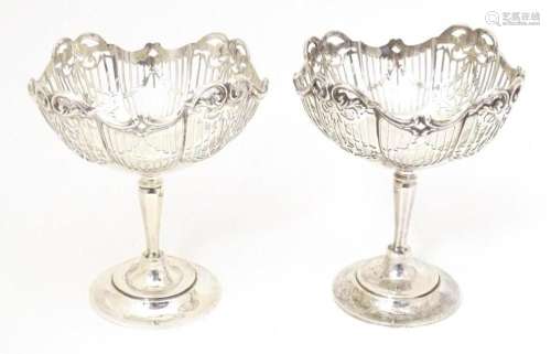 A pair of silver tall pedestal bon bon dishes with pierced d...