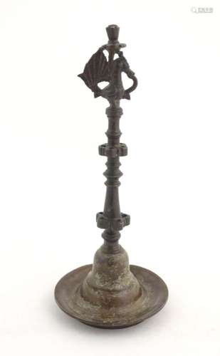 An Indian / Deccan cast temple style oil lamp with turned co...