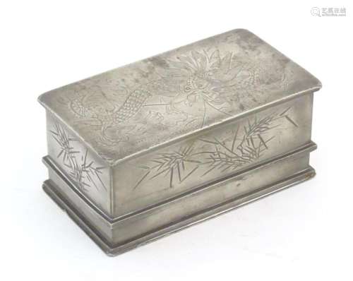 An early 20thC Chinese pewter lidded box of rectangular form...