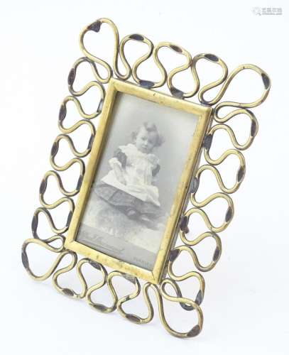 A Victorian easel back photograph frame with brass openwork ...