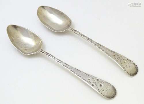 A pair of Geo III silver bright cut teaspoons, hallmarked Lo...