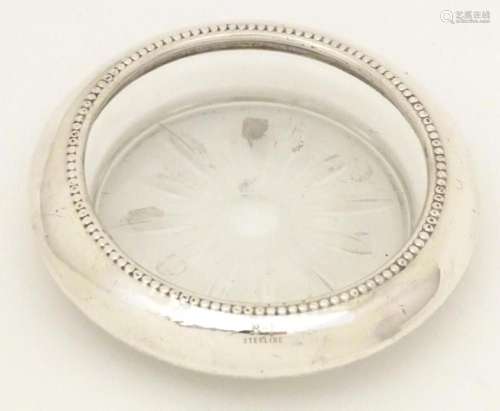 A glass dish / small coaster with sterling silver mount appr...