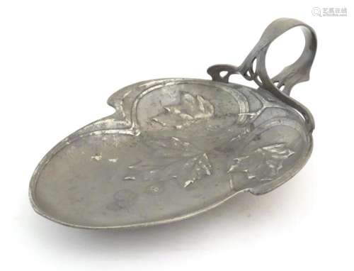 An Art Nouveau decorative metalware dish of leaf form with s...