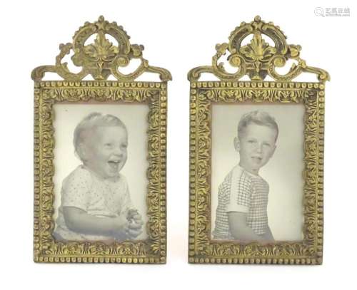A pair of late 19th / early 20thC cast brass frames with fol...