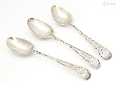 Three late 18th / early 19thC silver bright cut teaspoons, m...